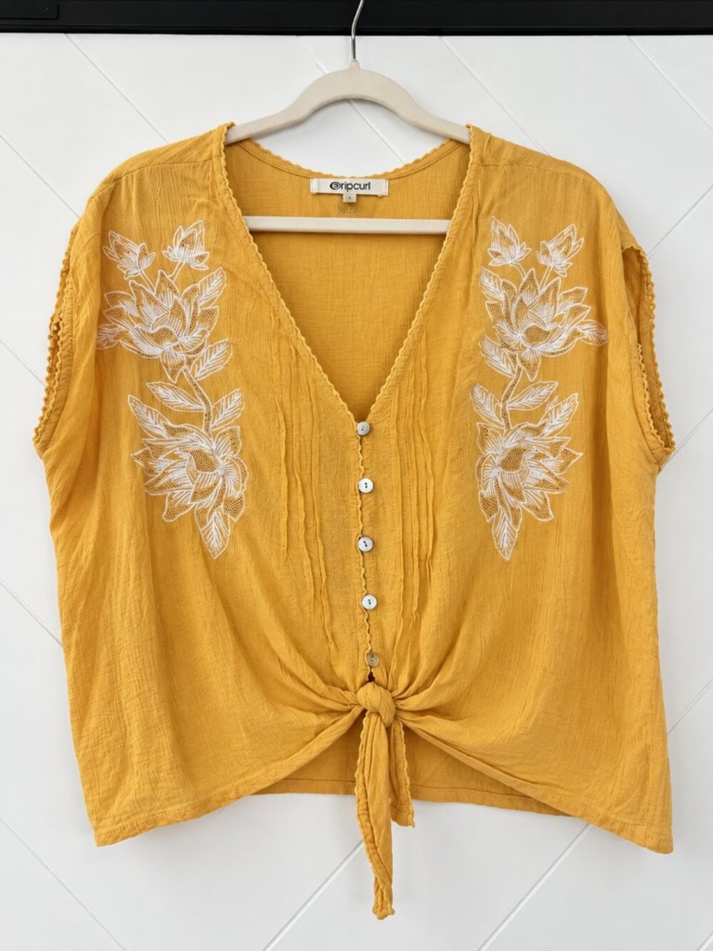 Rip Curl Mustard Yellow Button-Front Tie Hem Top with White Floral Embroidery
